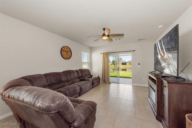 8813 Swell Brooks Ct, North Fort Myers, FL 33917 - living area with ceiling fan and light tile patterned floors