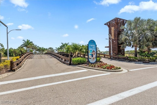 8813 Swell Brooks Ct, North Fort Myers, FL 33917 - view of asphalt street featuring street lighting and curbs