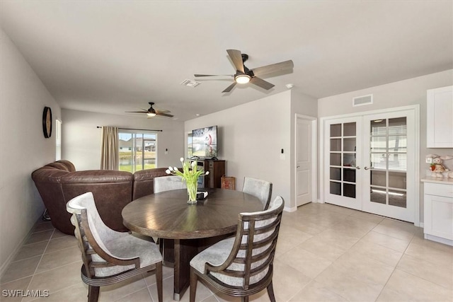 8813 Swell Brooks Ct, North Fort Myers, FL 33917 - dining room with a ceiling fan, french doors, and light tile patterned flooring