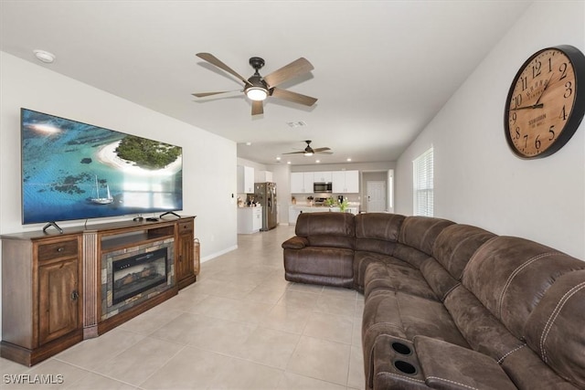 8813 Swell Brooks Ct, North Fort Myers, FL 33917 - living area with a ceiling fan, light tile patterned floors, a glass covered fireplace, and recessed lighting