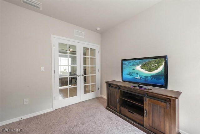 8813 Swell Brooks Ct, North Fort Myers, FL 33917 - unfurnished living room with french doors and carpet flooring