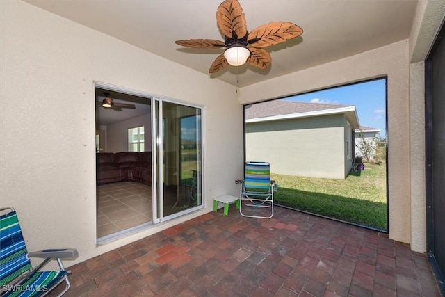 8813 Swell Brooks Ct, North Fort Myers, FL 33917 - unfurnished sunroom featuring a ceiling fan