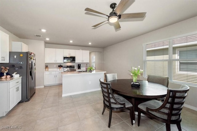 8813 Swell Brooks Ct, North Fort Myers, FL 33917 - dining room featuring a ceiling fan, light tile patterned floors, and recessed lighting