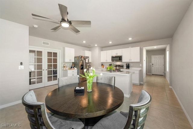 8813 Swell Brooks Ct, North Fort Myers, FL 33917 - dining area with french doors, light tile patterned floors, a ceiling fan, and recessed lighting