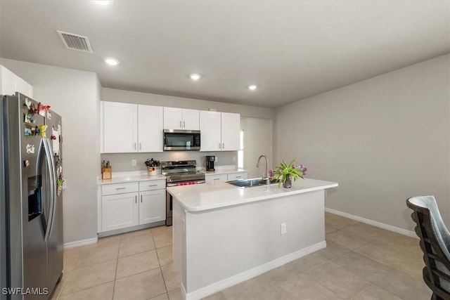 8813 Swell Brooks Ct, North Fort Myers, FL 33917 - kitchen with appliances with stainless steel finishes, light countertops, white cabinetry, and recessed lighting