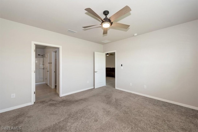 8813 Swell Brooks Ct, North Fort Myers, FL 33917 - unfurnished bedroom featuring carpet floors, ceiling fan, and ensuite bathroom