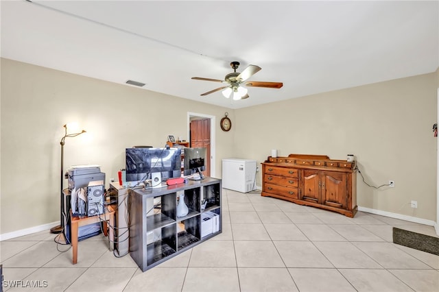 office featuring ceiling fan, baseboards, visible vents, and light tile patterned floors