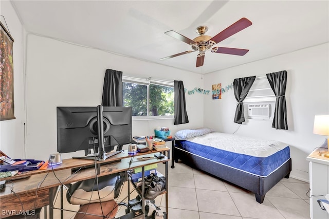 bedroom with light tile patterned floors, a ceiling fan, and cooling unit