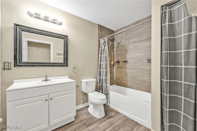 full bathroom with vanity, baseboards, toilet, shower / bath combo with shower curtain, and wood finished floors