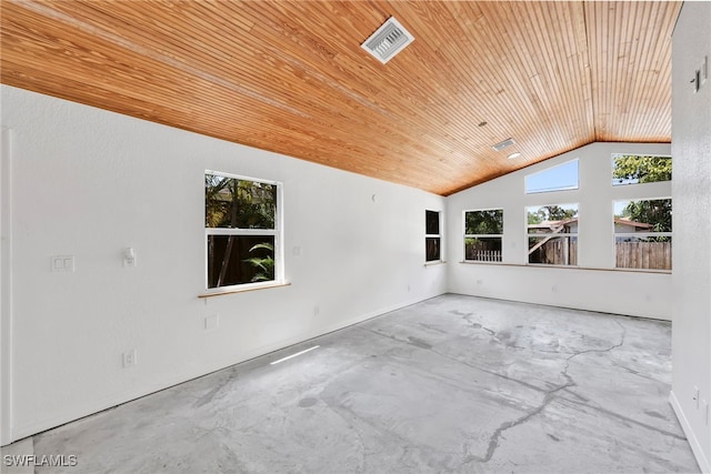 empty room with concrete flooring, visible vents, wood ceiling, and lofted ceiling