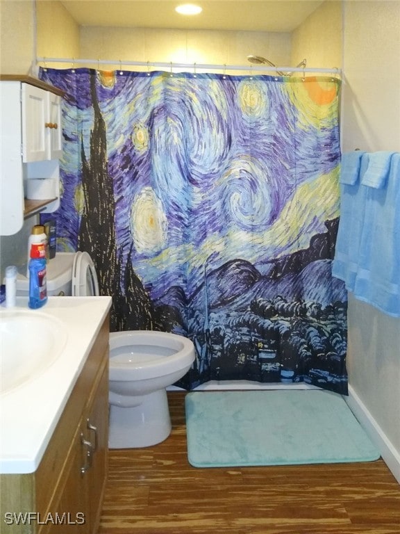 full bath with vanity, a shower with curtain, toilet, and wood finished floors