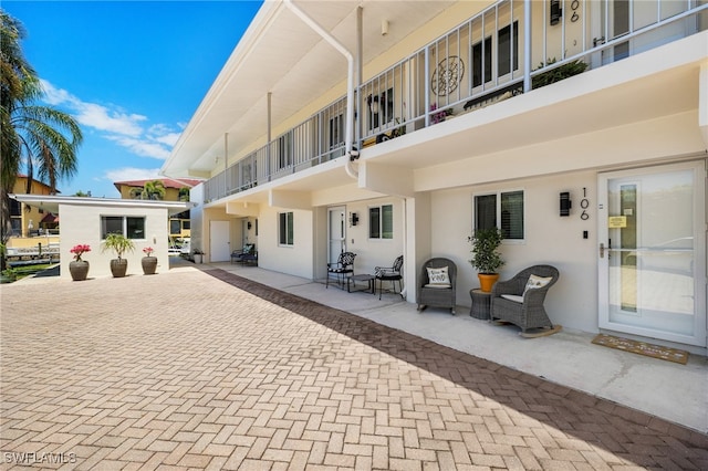 exterior space featuring stucco siding