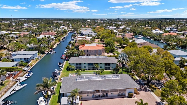 bird's eye view featuring a water view and a residential view