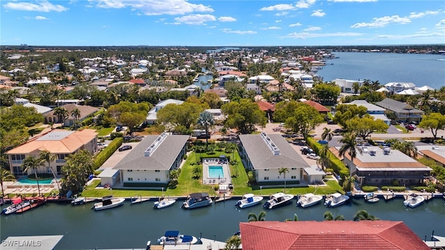 birds eye view of property featuring a water view and a residential view