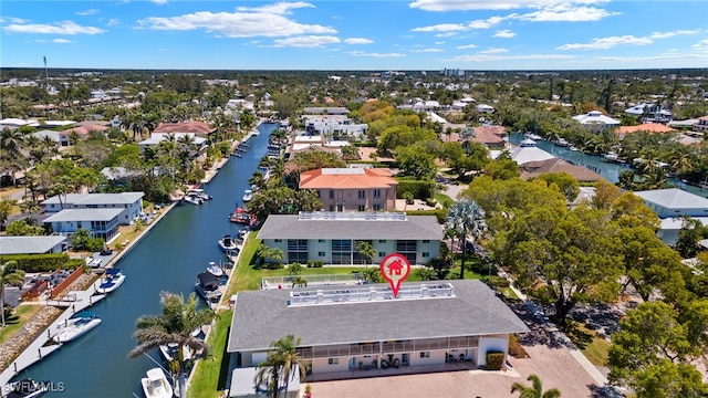 birds eye view of property with a water view and a residential view