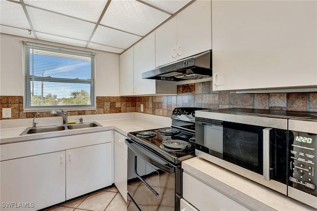 kitchen featuring white cabinetry, stainless steel microwave, under cabinet range hood, a sink, and black / electric stove