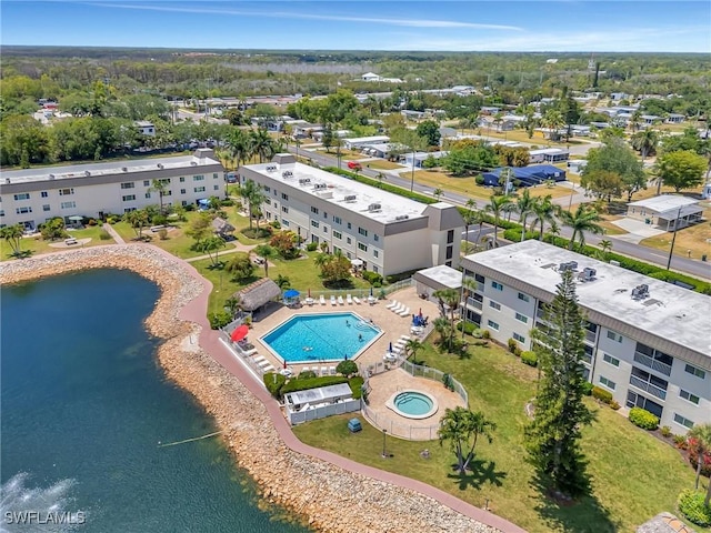 birds eye view of property with a water view