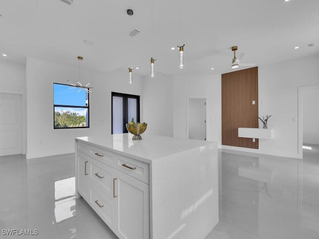 kitchen with white cabinets, open floor plan, ceiling fan, recessed lighting, and pendant lighting