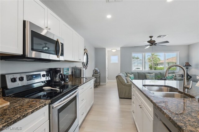 1357 Merrimac Ave, Marco Island, FL 34145 - kitchen featuring visible vents, a sink, stainless steel appliances, white cabinets, and light wood-type flooring