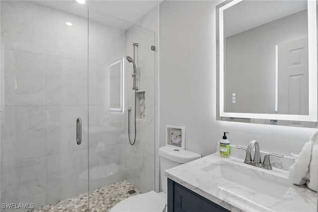 1357 Merrimac Ave, Marco Island, FL 34145 - bathroom with toilet, vanity, and a shower stall