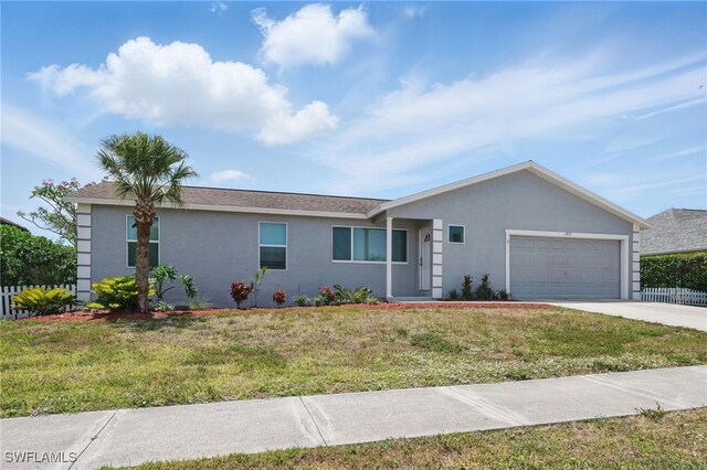1357 Merrimac Ave, Marco Island, FL 34145 - ranch-style home featuring concrete driveway, an attached garage, stucco siding, and a front lawn