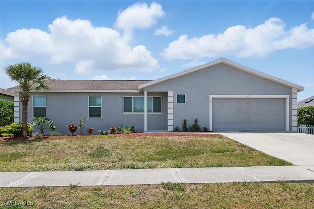 1357 Merrimac Ave, Marco Island, FL 34145 - ranch-style home featuring concrete driveway, stucco siding, a front yard, and a garage