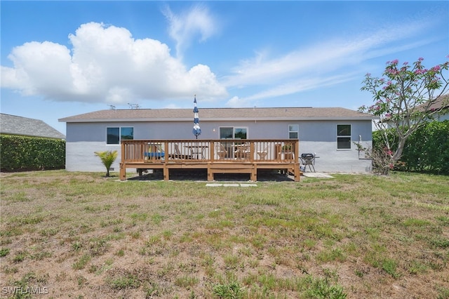 1357 Merrimac Ave, Marco Island, FL 34145 - rear view of property with a yard, stucco siding, and a wooden deck