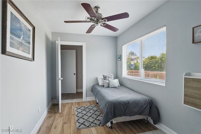 1357 Merrimac Ave, Marco Island, FL 34145 - bedroom with baseboards, light wood-style floors, and a ceiling fan