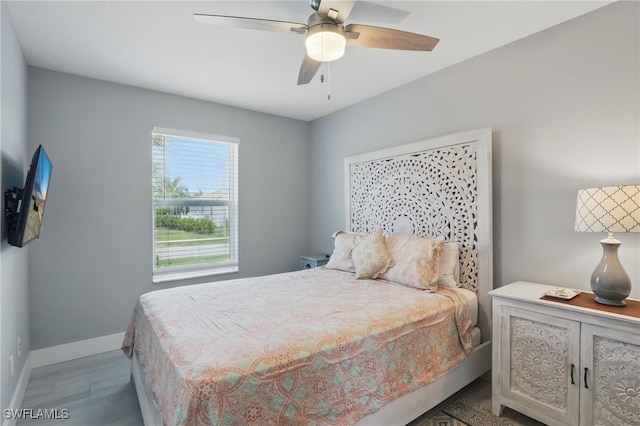 1357 Merrimac Ave, Marco Island, FL 34145 - bedroom with baseboards, a ceiling fan, and wood finished floors