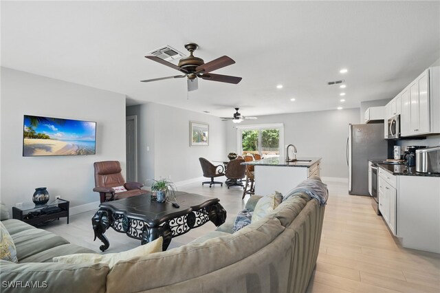 1357 Merrimac Ave, Marco Island, FL 34145 - living room with visible vents, recessed lighting, a ceiling fan, baseboards, and light wood-style floors