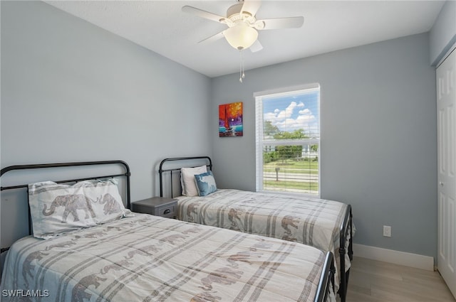 1357 Merrimac Ave, Marco Island, FL 34145 - bedroom with a ceiling fan, wood finished floors, and baseboards
