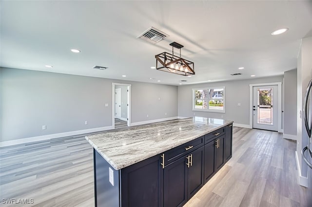 446 Lake Murex Cir, Sanibel, FL 33957 - kitchen with visible vents, baseboards, recessed lighting, light wood-type flooring, and hanging light fixtures