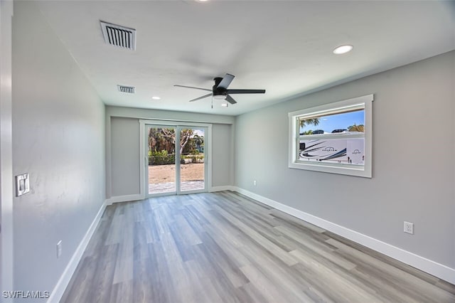 446 Lake Murex Cir, Sanibel, FL 33957 - spare room featuring baseboards, ceiling fan, wood finished floors, and visible vents