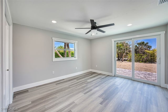 446 Lake Murex Cir, Sanibel, FL 33957 - empty room with plenty of natural light, baseboards, wood finished floors, and visible vents