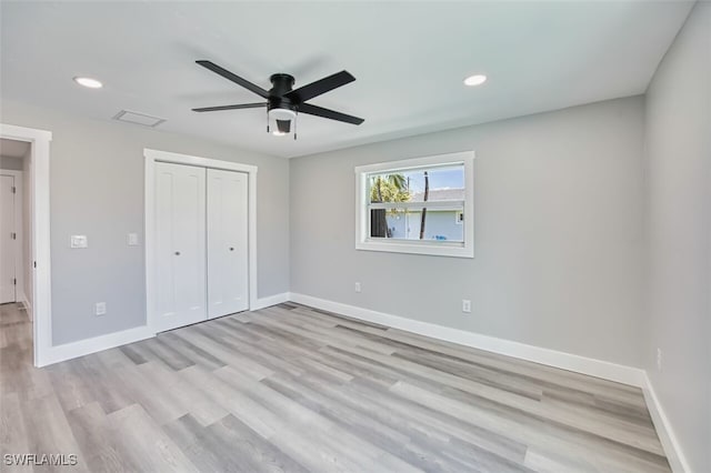 446 Lake Murex Cir, Sanibel, FL 33957 - unfurnished bedroom featuring recessed lighting, baseboards, light wood-style flooring, and a closet