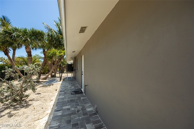 446 Lake Murex Cir, Sanibel, FL 33957 - view of side of home featuring central AC and stucco siding