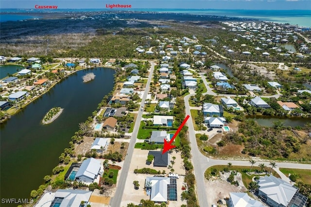446 Lake Murex Cir, Sanibel, FL 33957 - bird's eye view featuring a water view and a residential view