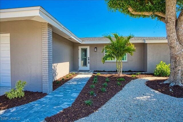 446 Lake Murex Cir, Sanibel, FL 33957 - view of exterior entry with stucco siding