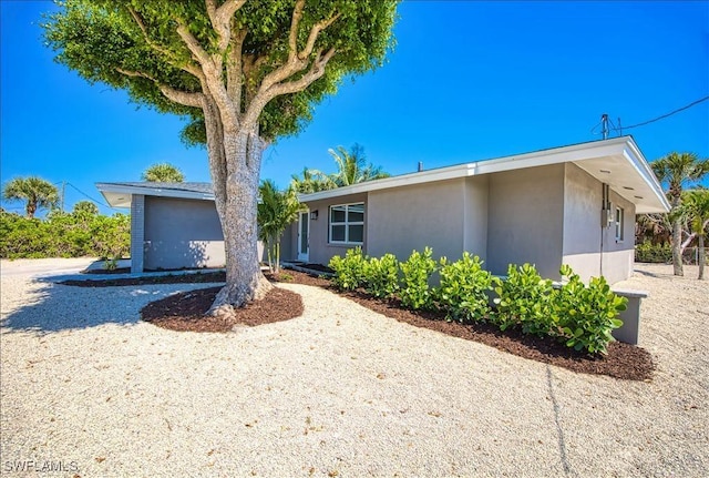 446 Lake Murex Cir, Sanibel, FL 33957 - view of front of home featuring stucco siding
