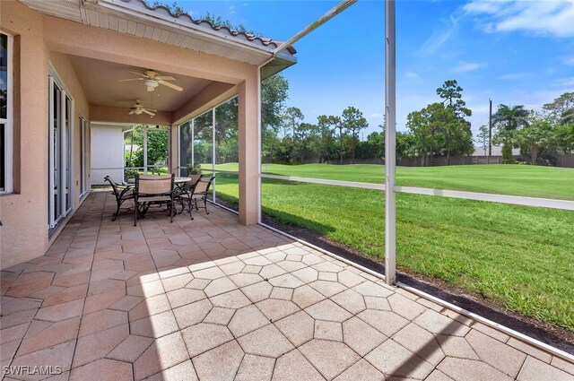 317 Harvard Ln, Naples, FL 34104 - sunroom with ceiling fan, outdoor dining space, and view of golf course