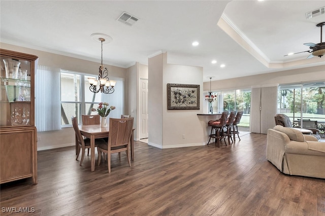 317 Harvard Ln, Naples, FL 34104 - dining space with crown molding, a chandelier, baseboards, a ceiling fan, and dark wood finished floors