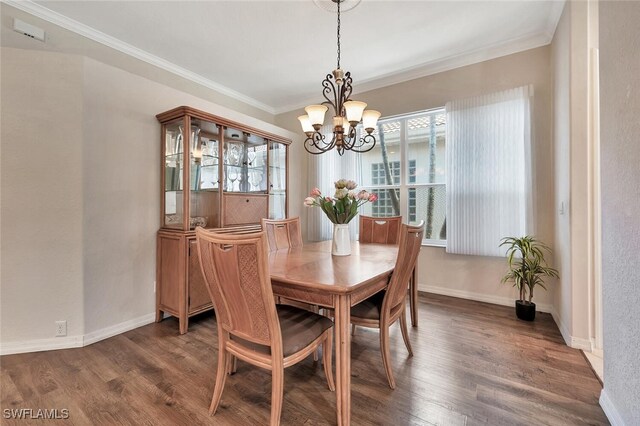317 Harvard Ln, Naples, FL 34104 - dining area with a chandelier, wood finished floors, baseboards, and crown molding