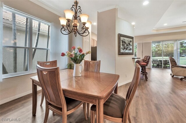 317 Harvard Ln, Naples, FL 34104 - dining area with a chandelier, baseboards, wood finished floors, ornamental molding, and recessed lighting