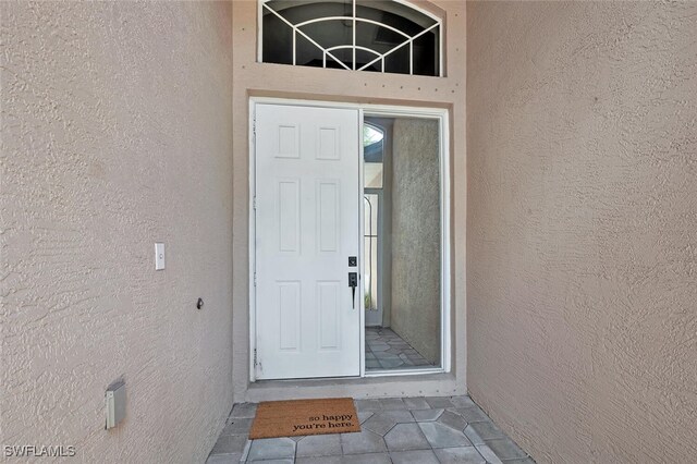 317 Harvard Ln, Naples, FL 34104 - property entrance featuring stucco siding