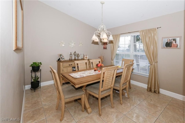 2049 NE 27th Ter, Cape Coral, FL 33909 - dining space featuring light tile patterned floors, a notable chandelier, and baseboards