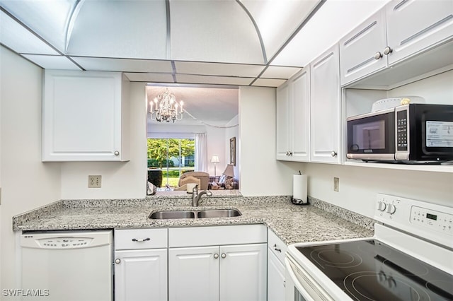 6184 Michelle Way Unit 105, Fort Myers, FL 33919 - kitchen featuring an inviting chandelier, white appliances, light stone countertops, white cabinetry, and a sink