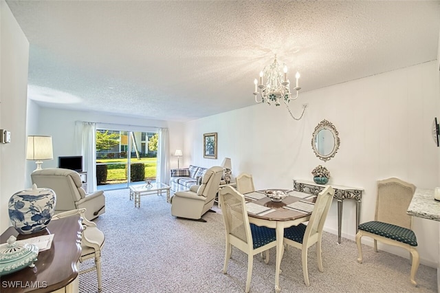 6184 Michelle Way Unit 105, Fort Myers, FL 33919 - carpeted dining area featuring a textured ceiling and a notable chandelier
