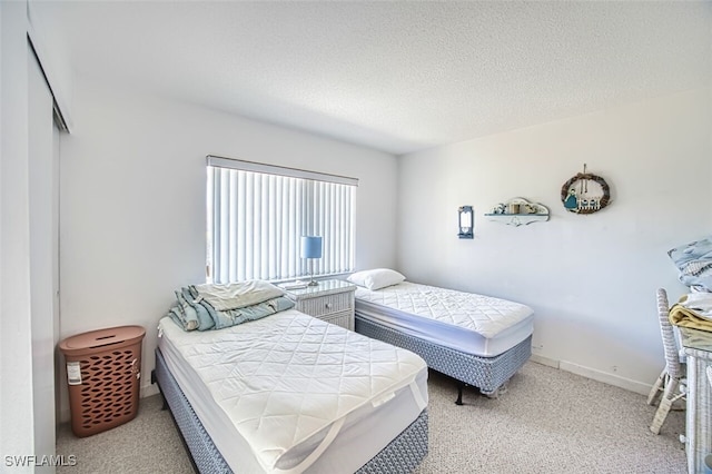 6184 Michelle Way Unit 105, Fort Myers, FL 33919 - bedroom with carpet flooring and a textured ceiling