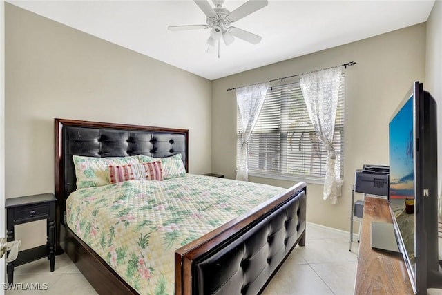 bedroom featuring ceiling fan, baseboards, and light tile patterned floors