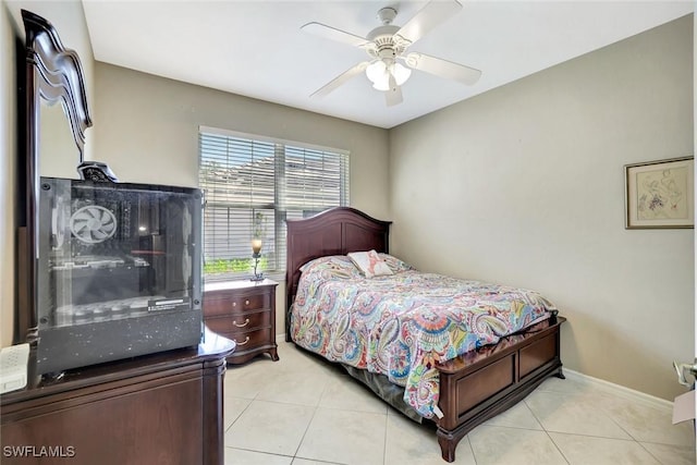 bedroom with baseboards, ceiling fan, and light tile patterned floors